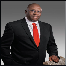 Dr. Claude D. Brunson